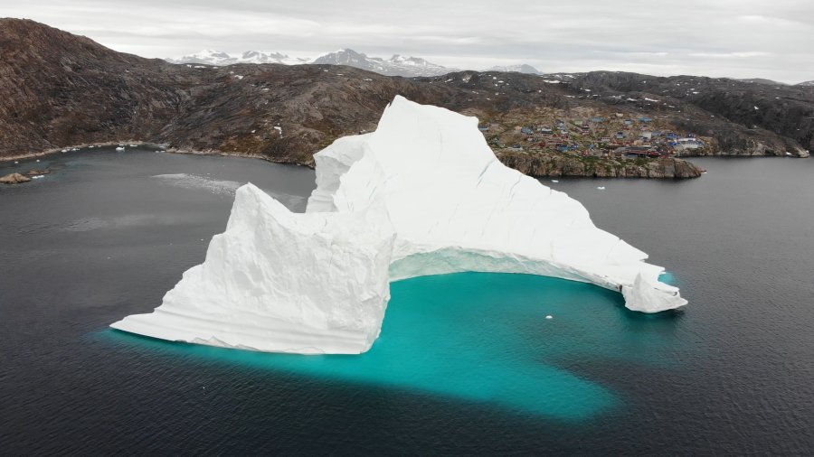 An 11-million-ton iceberg is threatening the isolated fishing village of Innaarsuit, Greenland. (Credit: CNN)