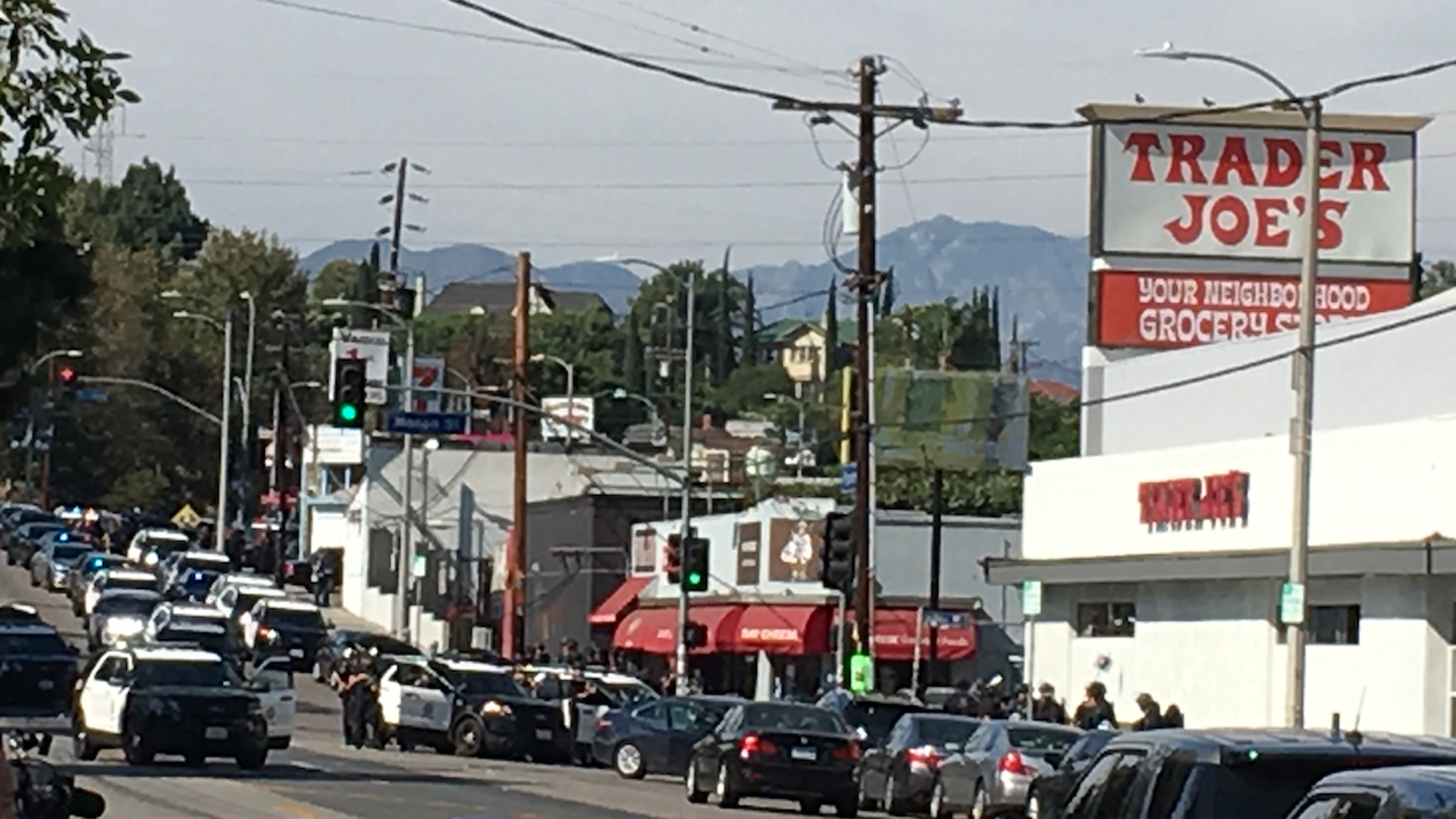 Police are seen outside a Silver Lake Trader Joe's store, where a possible hostage situation was reported on July 21, 2018. (Credit: KTLA)