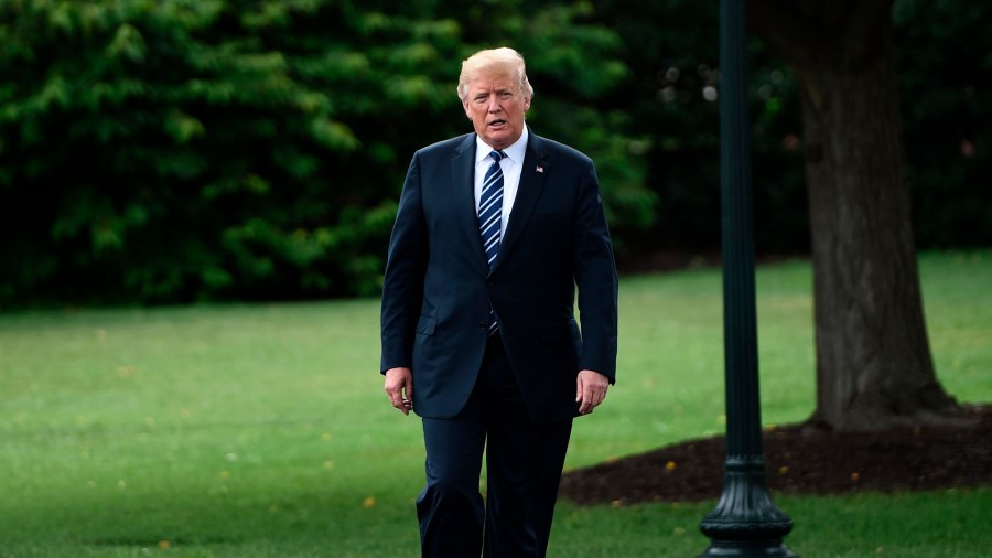 President Donald Trump walks to a “Made in America” showcase event at the White House gardens on July 23, 2018. (Credit: BRENDAN SMIALOWSKI/AFP/Getty Images)