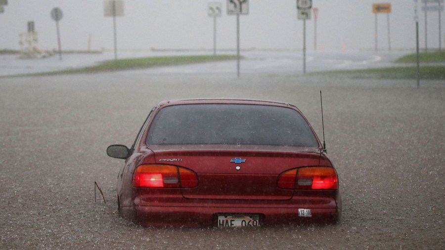 A car is seen partially submerged in water from Hurricane Lane rainfall on the Big Island of Hawaii on Thursday, Aug. 23, 2018. (Credit: Getty Images)