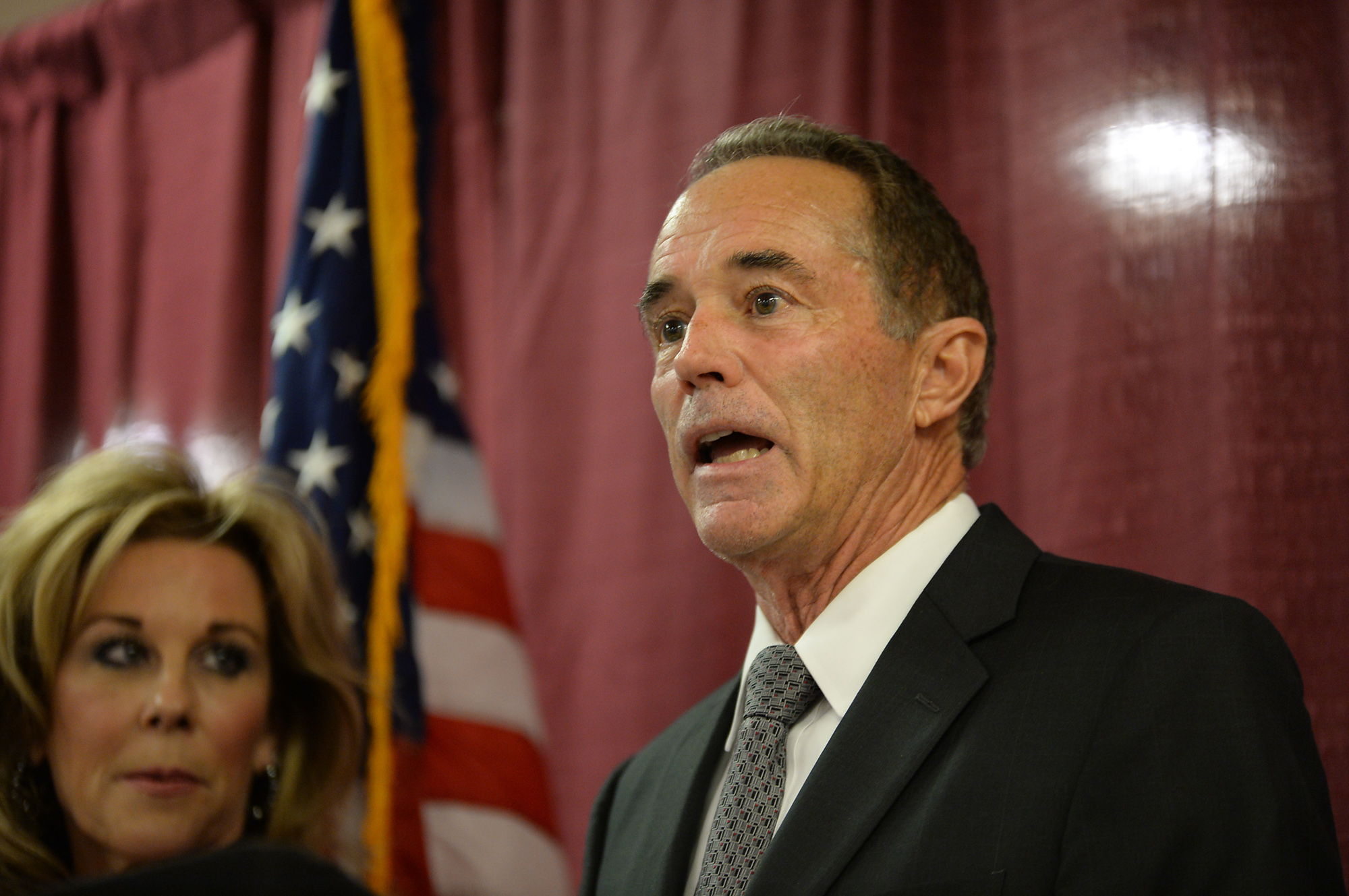 U.S. Rep. Chris Collins, R-NY, with his wife Mary at his side, holds a news conference on Aug. 8, 2018 in Buffalo, New York. (Credit: John Normile/Getty Images)