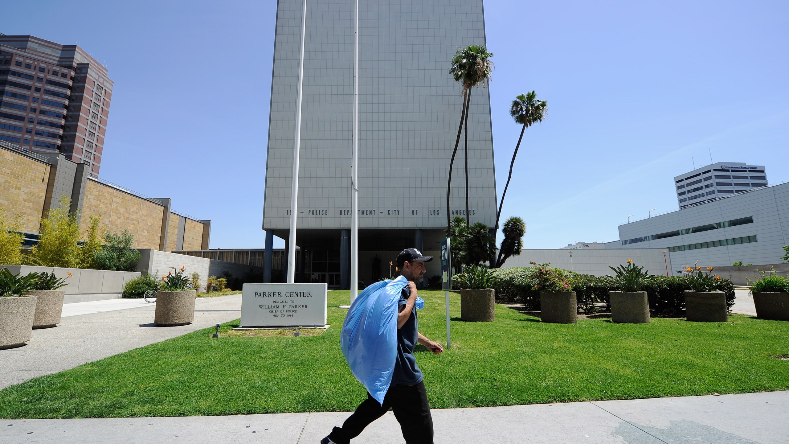 A man walks past the now empty Los Angeles Police Department headquarters, Parker Center, which was one of the flash points of the 1992 L.A. riots, on April 28, 2012. (Credit: Kevork Djansezian / Getty Images)