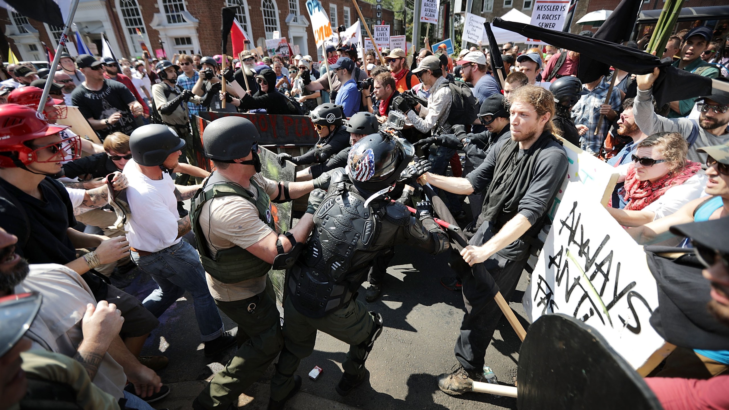 White nationalists, neo-Nazis and members of the "alt-right" clash with counter-protesters as they enter Emancipation Park during the "Unite the Right" rally in Charlottesville, Virginia on Aug. 12, 2017. (Credit: Chip Somodevilla/Getty Images)