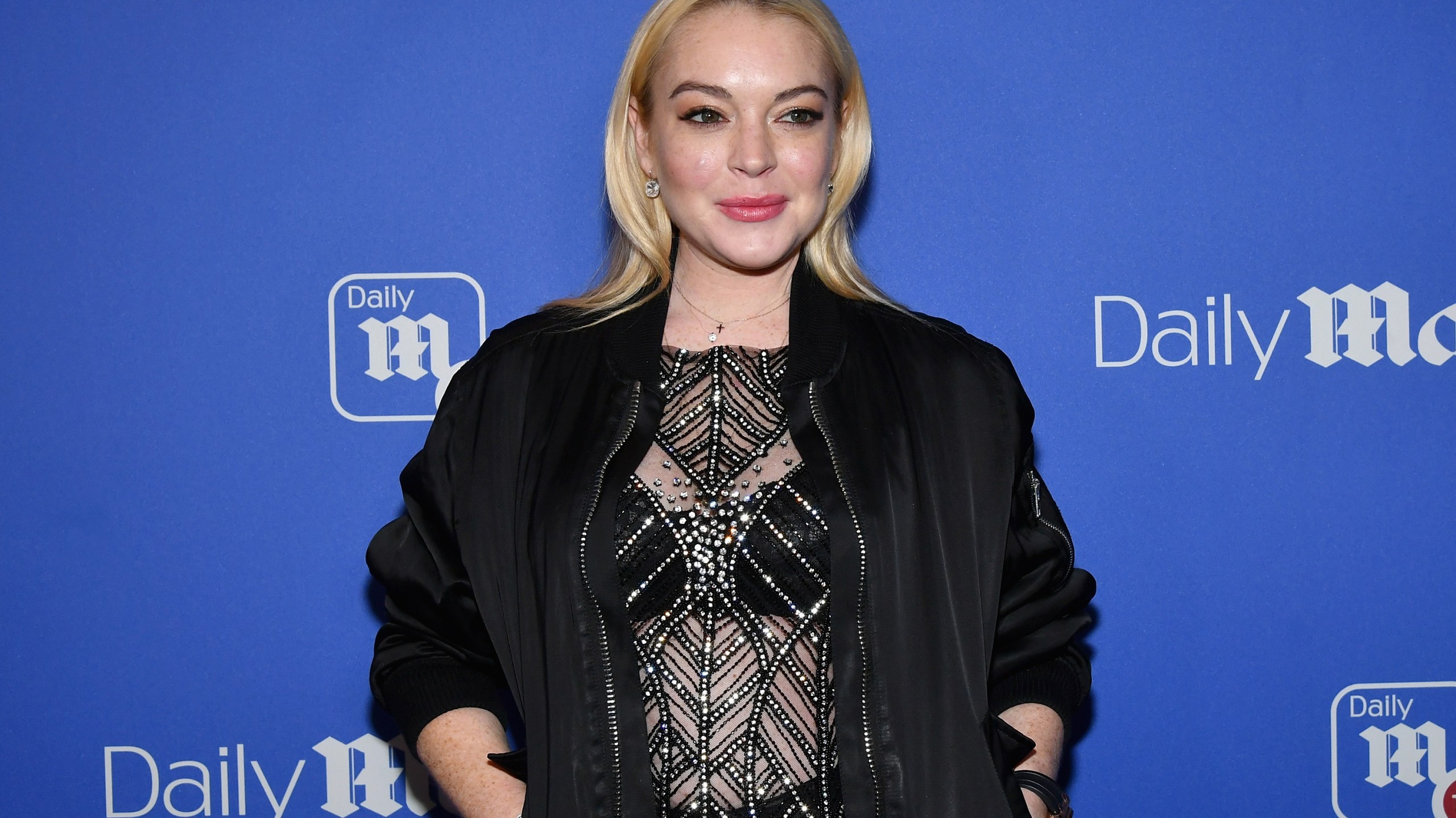 Lindsay Lohan attends DailyMail.com & DailyMailTV Holiday Party with Flo Rida on December 6, 2017 at The Magic Hour in New York City. (Credit: Slaven Vlasic/Getty Images for Daily Mail)