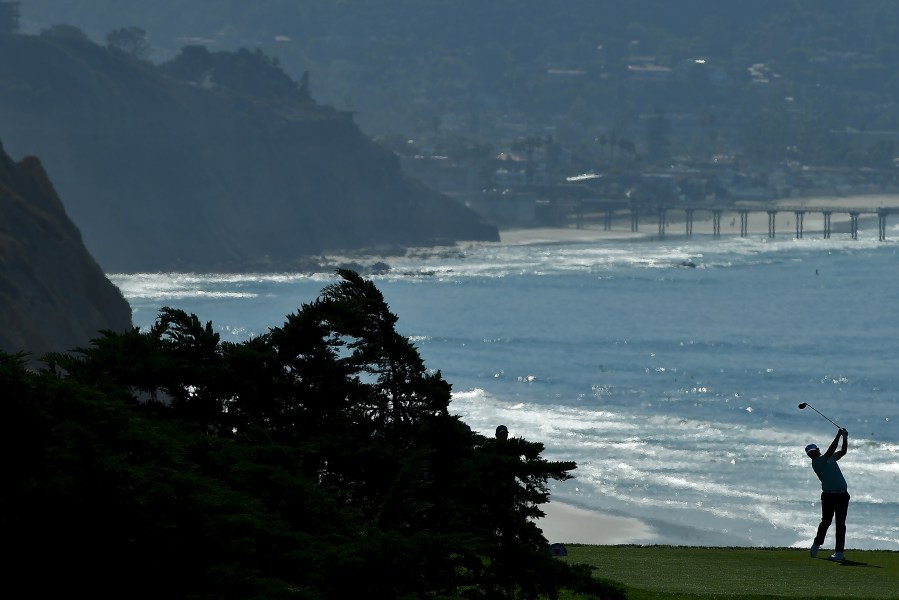 Tyler Torano plays his shot from the 16th tee, with Ellen Browning Scripps Memorial Pier in the background, during the first round of the Farmers Insurance Open at Torrey Pines North on Jan. 25, 2018, in San Diego. (Credit: Donald Miralle / Getty Images)