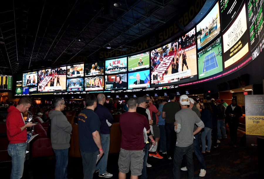 Guests line up to place bets as they attend a viewing party for the NCAA Men's College Basketball Tournament at the Westgate Las Vegas Resort and Casino on March 15, 2018. (Credit: Ethan Miller/Getty Images)