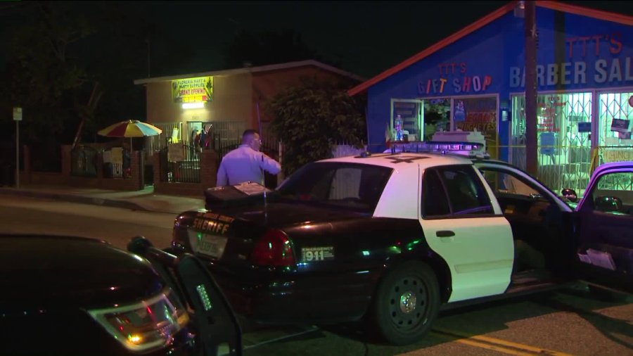 Authorities investigate the scene of a deadly shooting in Lennox on Aug. 6, 2018. (Credit: KTLA)