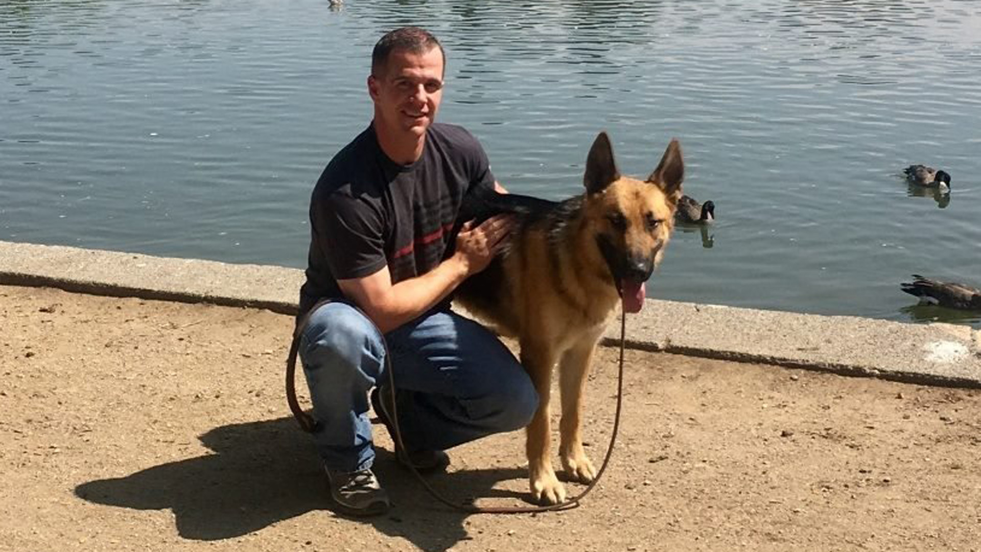 An undated photo shows Draper City firefighter Patrick reunited with Mendo. (Credit: Mendocino Animal Shelter via CNN)