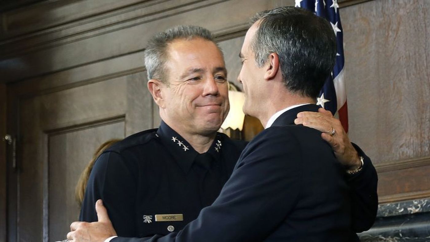 Los Angeles Mayor Eric Garcetti congratulates Michel Moore in June 2018 after announcing the police veteran as his choice for chief. (Credit: Christina House / Los Angeles Times)