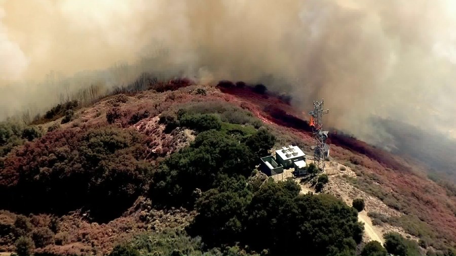 A flare-up from the Holy Fire was burning close to Santiago Peak on Aug. 27, 2018. (Credit: KTLA)