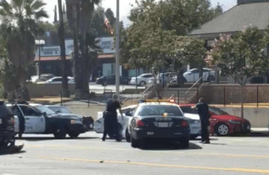 A still from a video recorded by a bystander shows Glendale police officers attempting to stop a driver on Foothill Avenue on Aug 21, 2018. (Credit: Shawn White Crescenta Valley Insurance Agency)