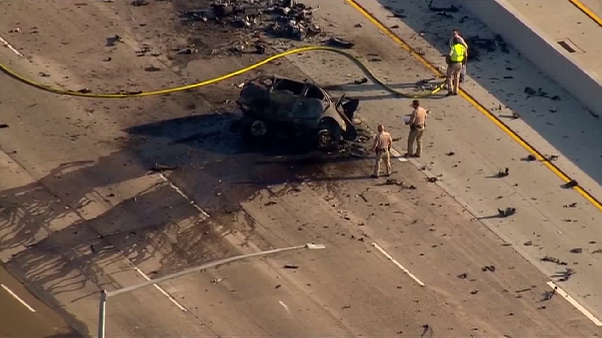 California Highway Patrol officials respond to an apparent wrong-way crash on the 805 Freeway in San Diego on Aug. 23, 2018. (Credit: KSWB)