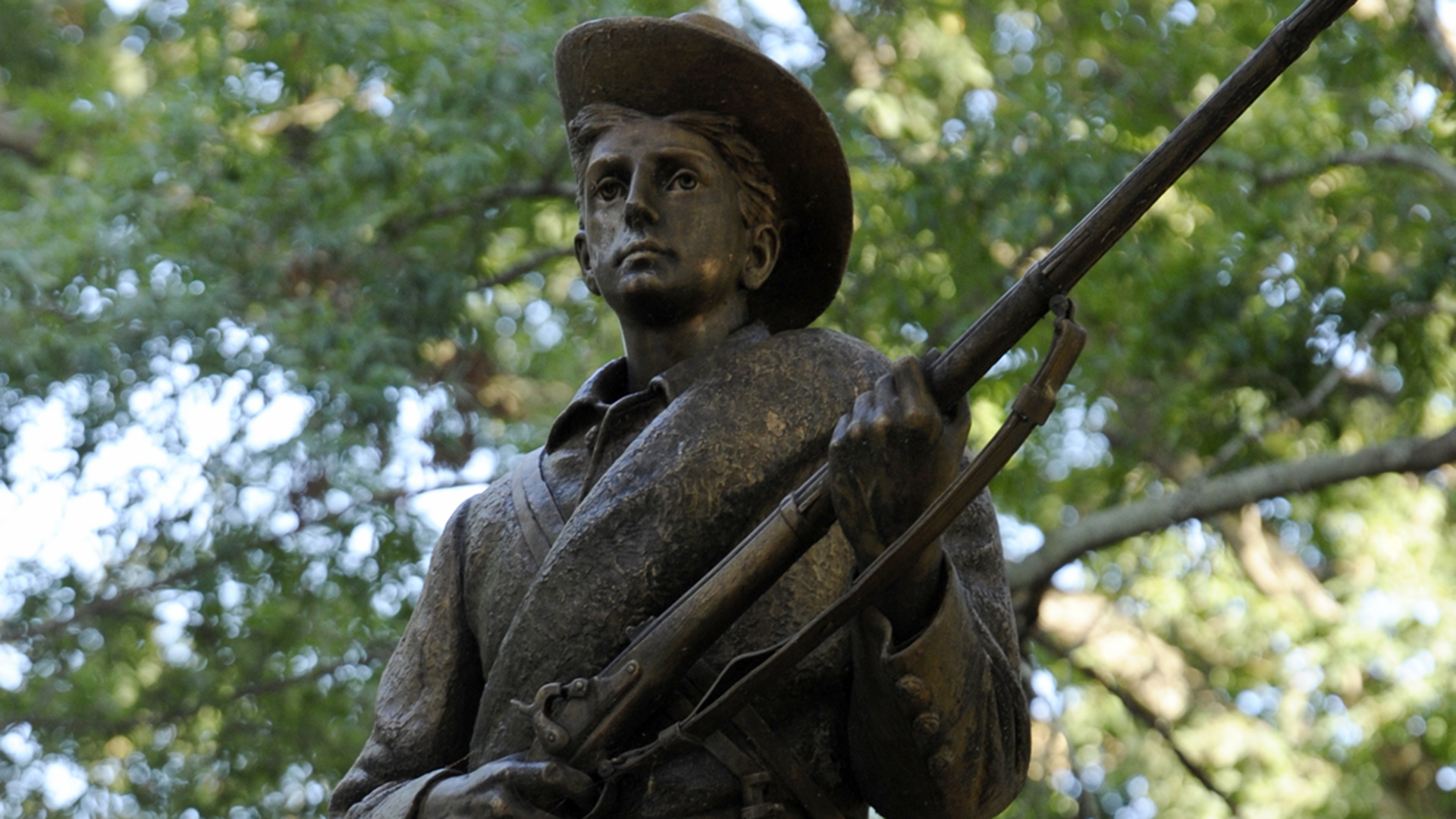 A Confederate statue, coined Silent Sam, is guarded by two layers of fence, chain and police on the campus of the University of Chapel Hill on August 22, 2017 in Chapel Hill North Carolina. (Credit: Sara D. Davis/Getty Images)