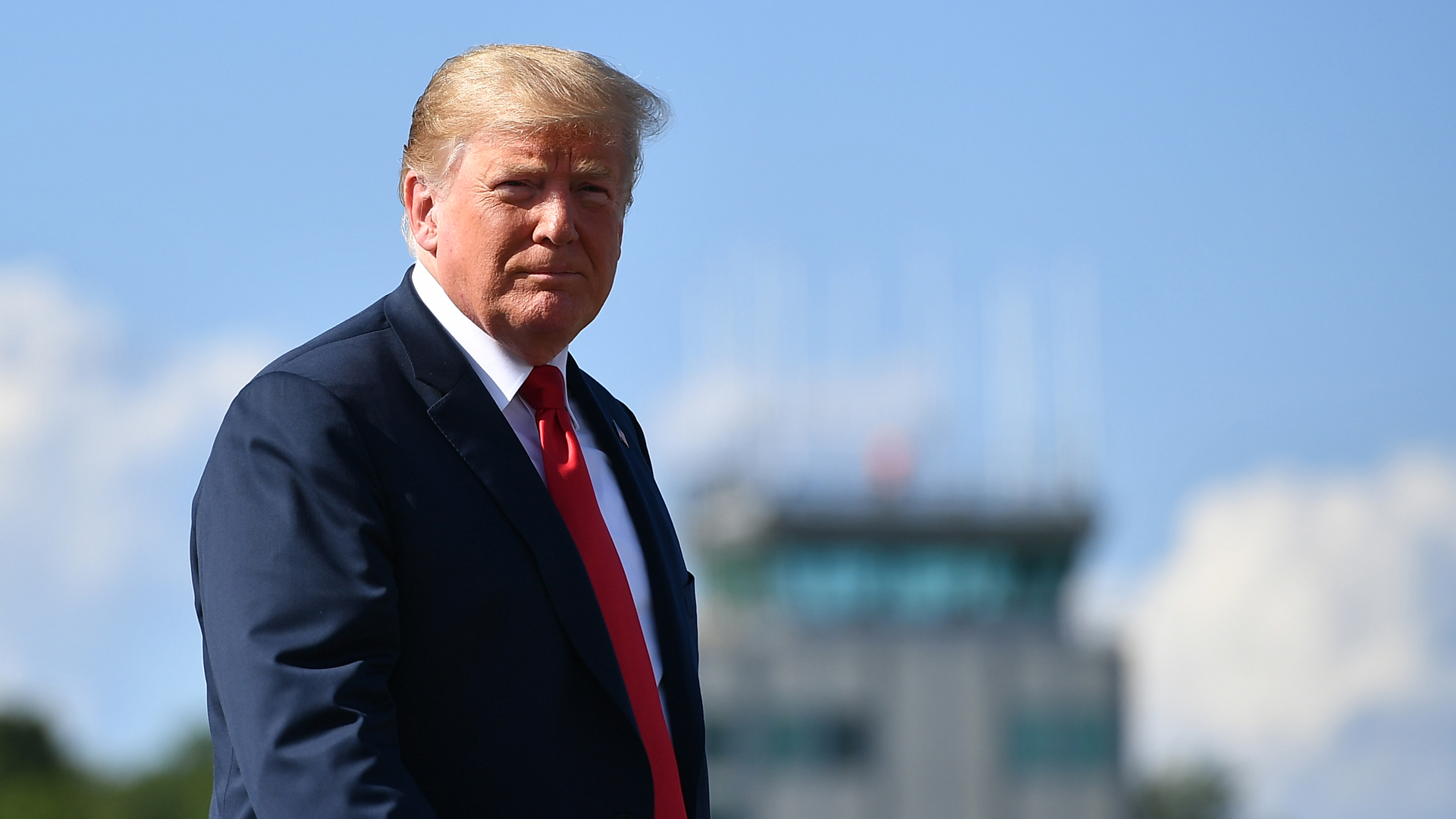 President Donald Trump makes his way to board Air Force One before departing from Morristown Municipal Airport in Morristown, New Jersey on August 4, 2018. (Credit: MANDEL NGAN/AFP/Getty Images)