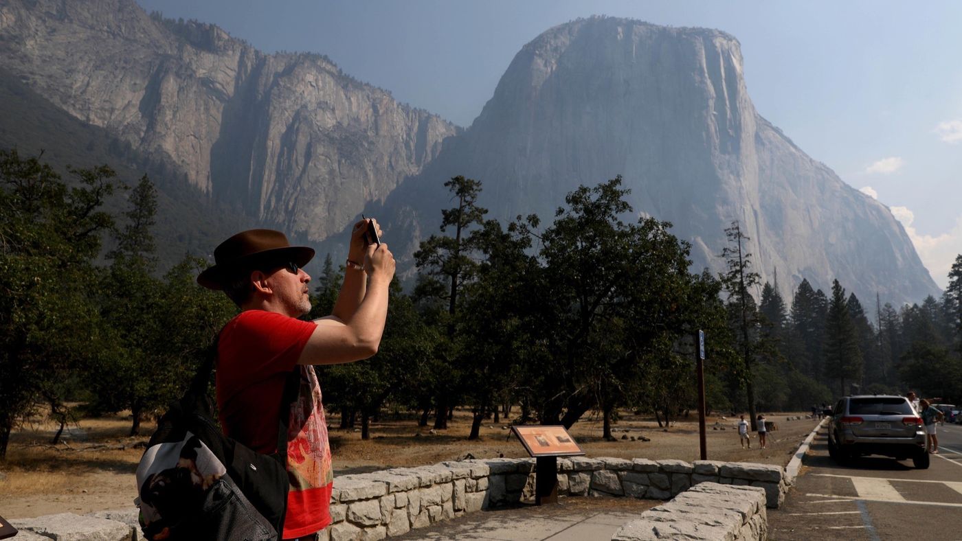 Steve Maddison of Holland photographs El Capitan upon Yosemite National Park's reopening Aug. 14, 2018. (Credit: Gary Coronado / Los Angeles Times)