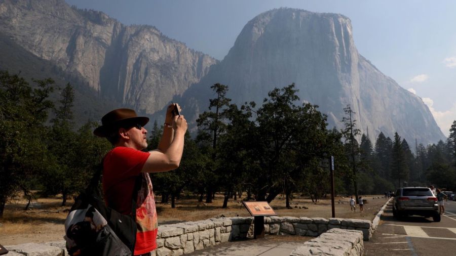 Steve Maddison of Holland photographs El Capitan upon Yosemite National Park's reopening Aug. 14, 2018. (Credit: Gary Coronado / Los Angeles Times)