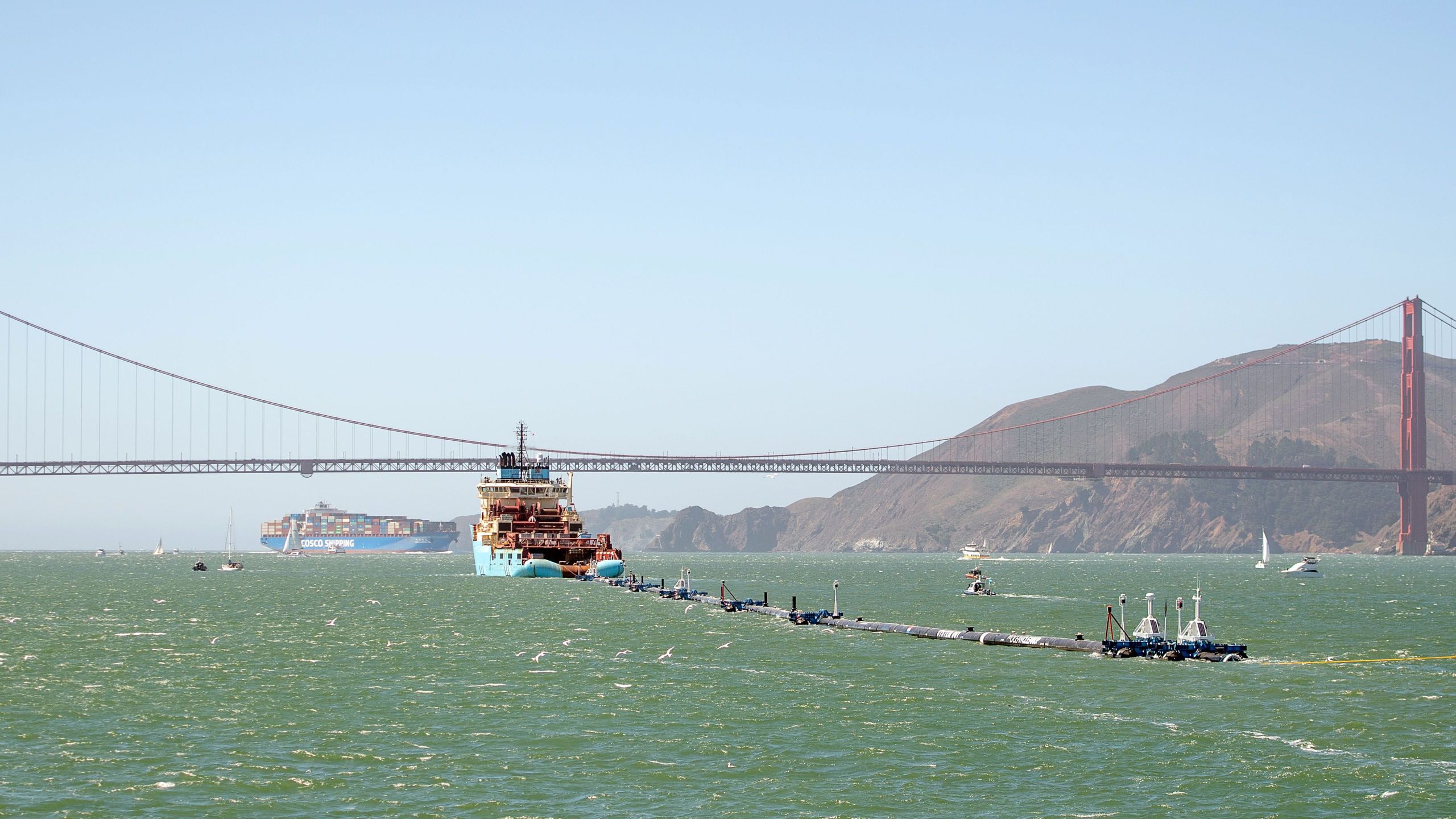 Ocean Cleanup's System 001 is towed out of the San Francisco Bay on Sept. 8, 2018. (Credit: Josh Edelson / AFP / Getty Images)