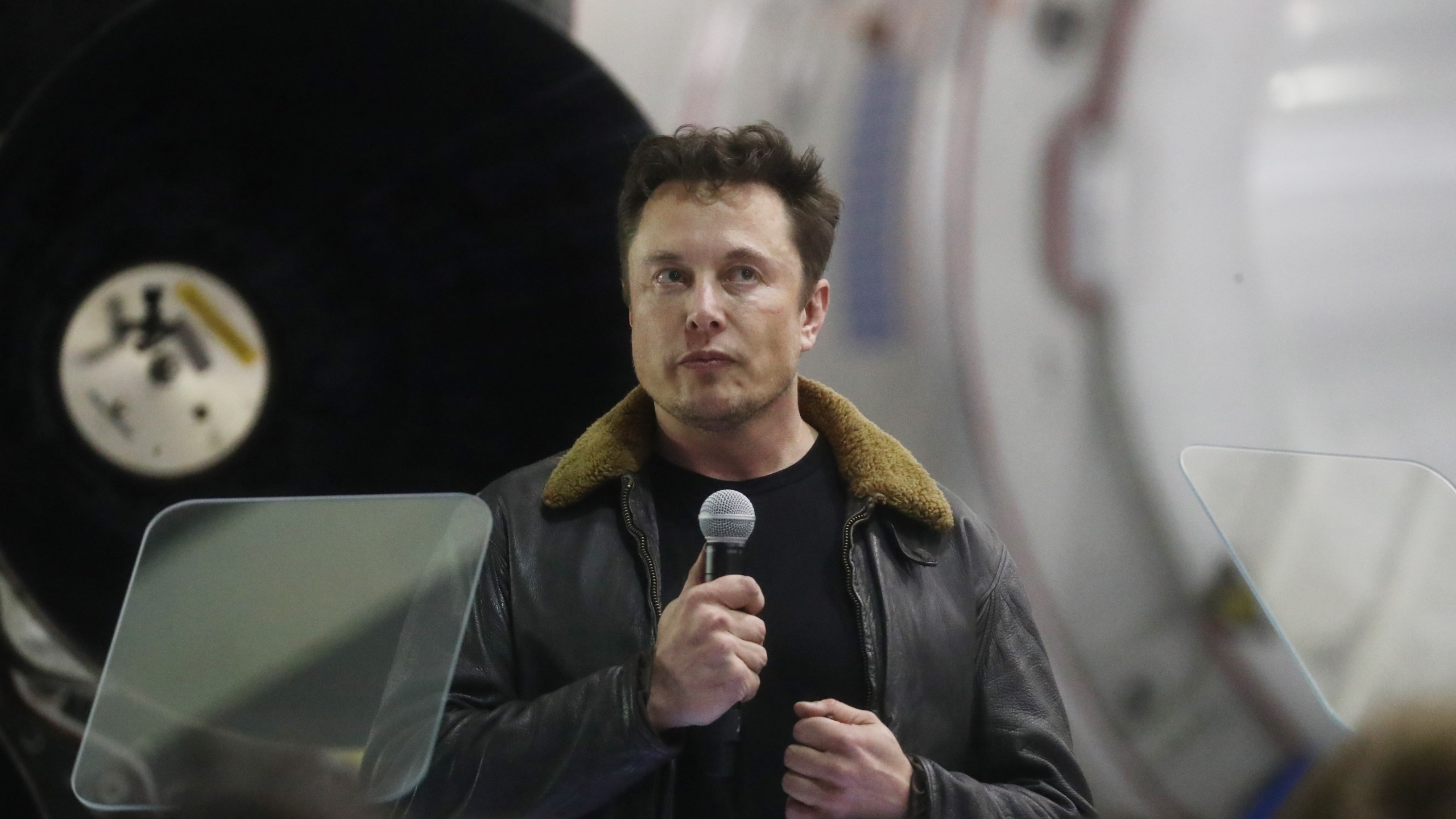 SpaceX CEO Elon Musk speaks at a press conference at company's Hawthorne headquarters, where he announced the Japanese billionaire chosen by the company to fly around the moon, on Sept. 17, 2018. (Credit: Mario Tama / Getty Images)