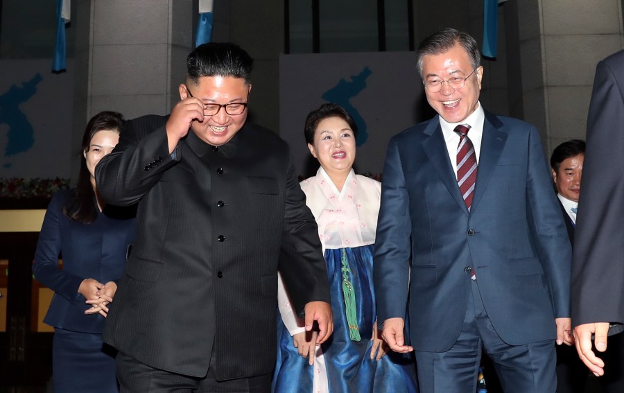 South Korea's President Moon Jae-in, right, leaves with North Korean leader Kim Jong Un after watching an art performance at Pyongyang Grand Theater on Sept.18, 2018 in Pyongyang, North Korea. (Credit: Pyeongyang Press Corps/Getty Images)