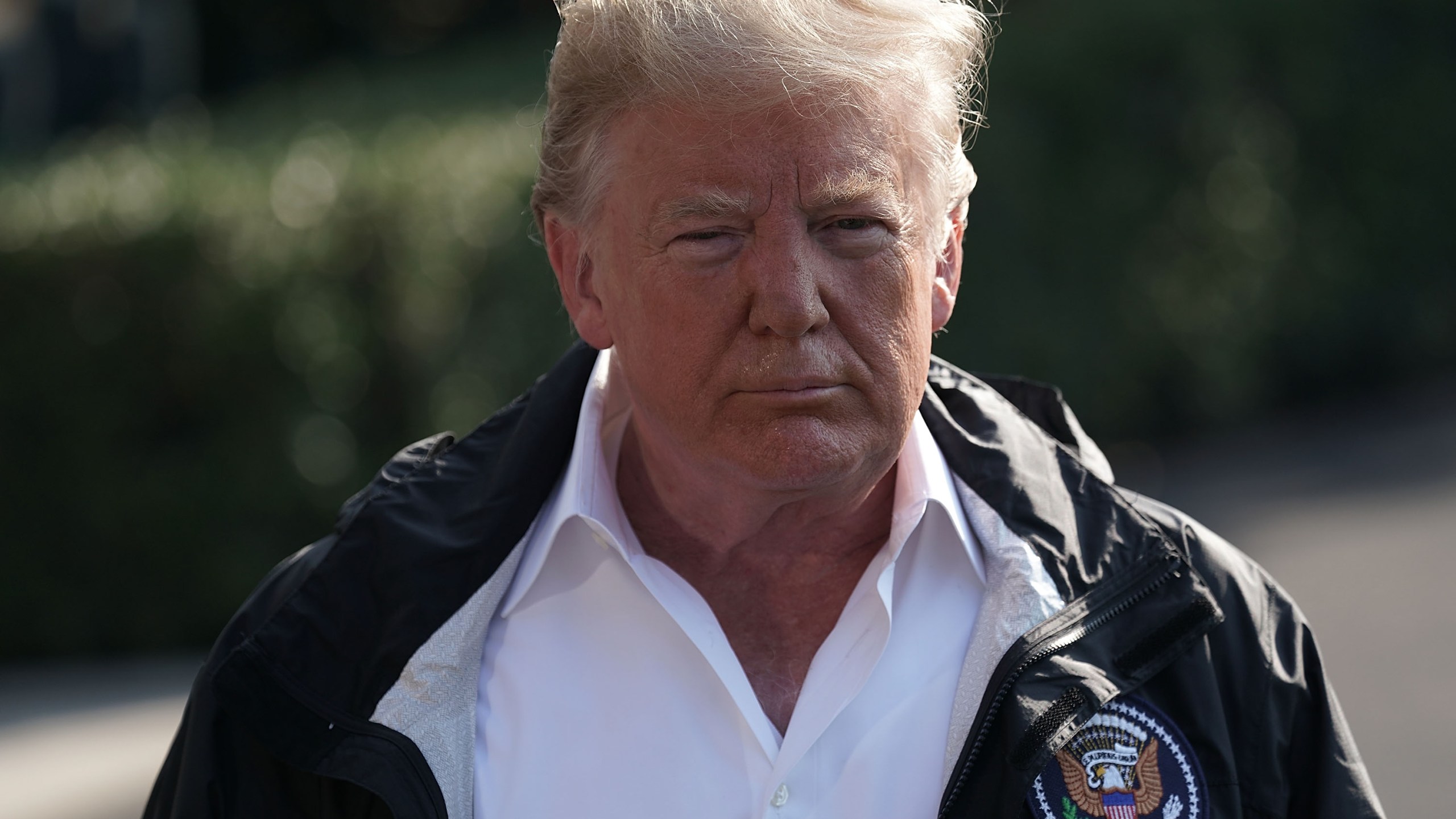 Donald Trump speaks to members of the media prior to a Marine One departure at the South Lawn of the White House on Sept. 19, 2018. (Credit: Alex Wong/Getty Images)