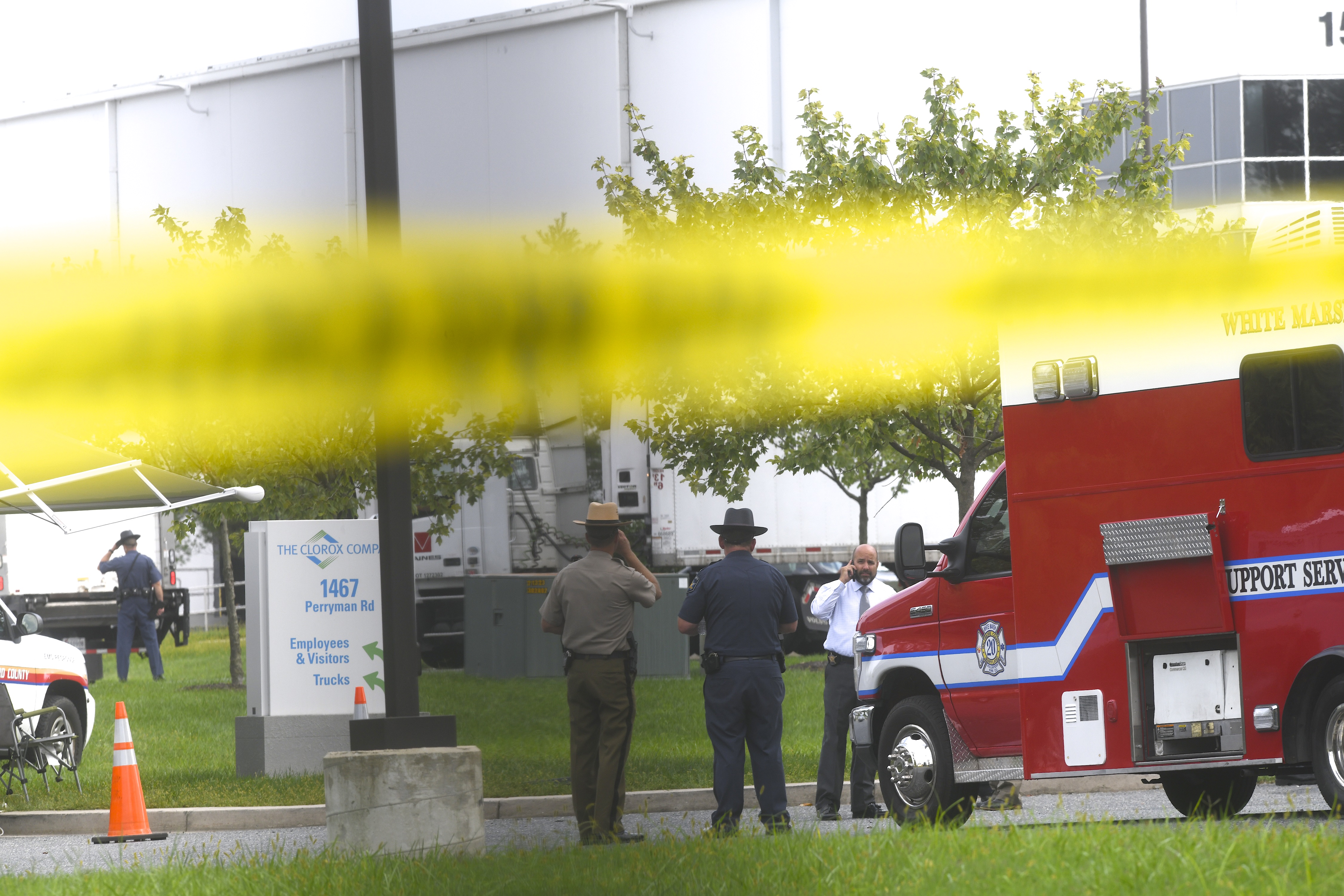 Police officers gather below crime scene tape in front of a Rite Aid Distribution Center where multiple people were killed and injured in a shooting on September 20, 2018 in Aberdeen, Maryland. (Credit: Mark Makela/Getty Images)