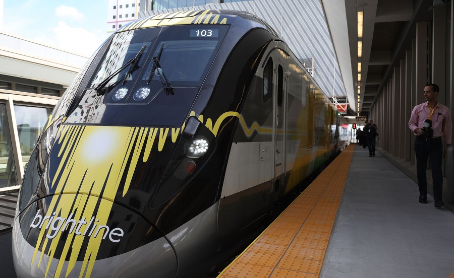 A Brightline train is seen at the new MiamiCentral terminal during the inaugural trip from Miami to West Palm Beach on May 11, 2018 in Miami, Florida. (Credit: Joe Raedle/Getty Images)