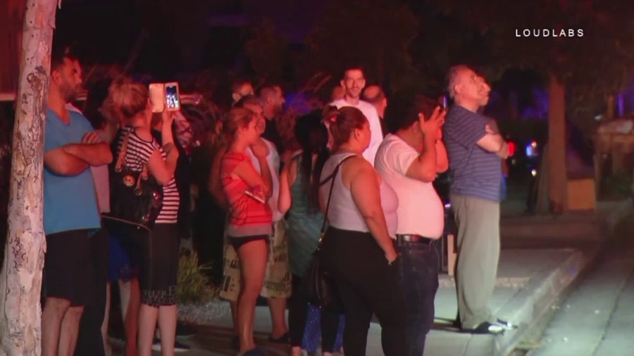 Onlookers watch an apartment fire in Glendale on Sept. 12, 2018. (Credit: Loudlabs)