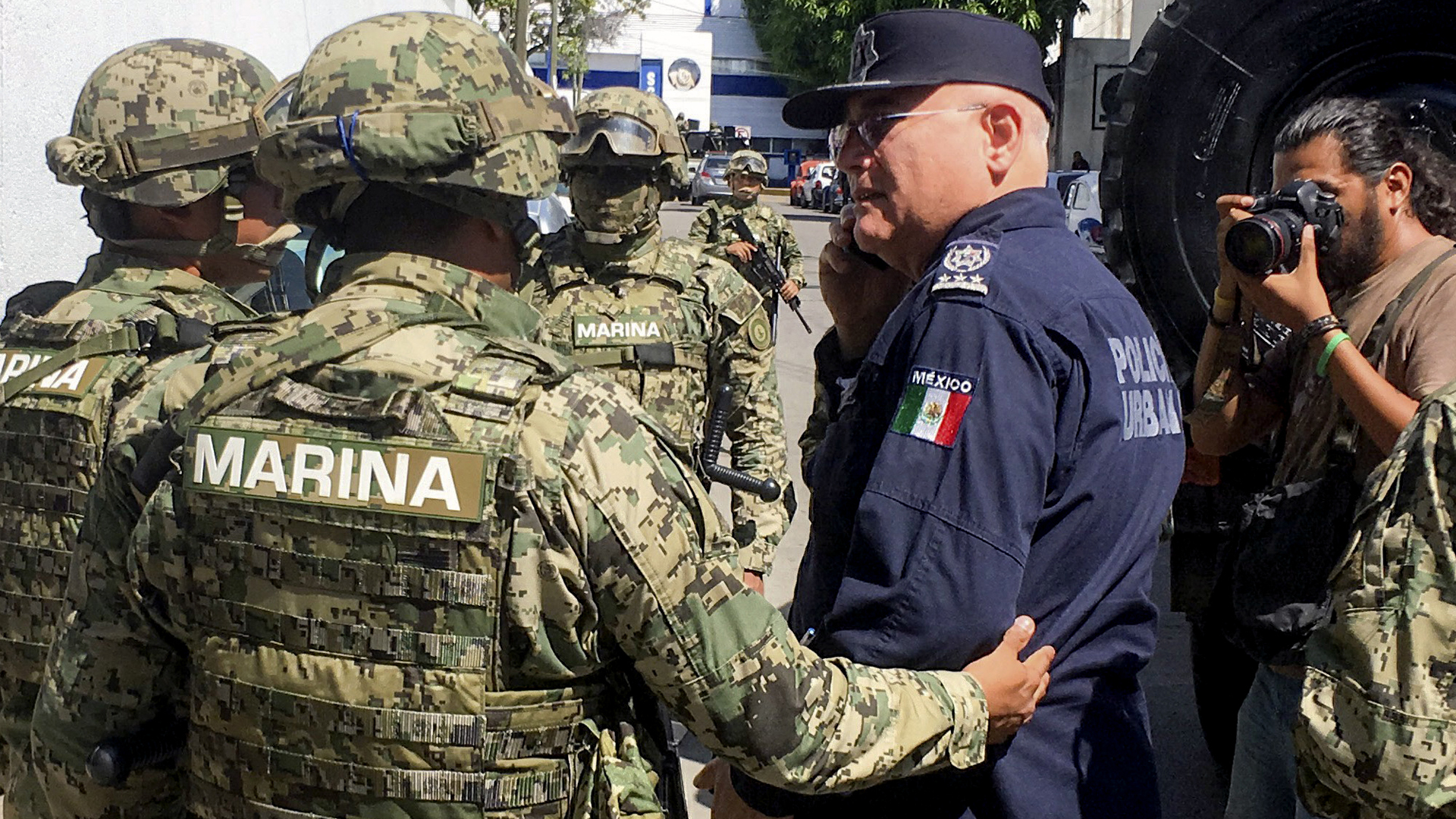 Mexican Navy members escort the Secretary of Public Security of Acapulco Max Lorenzo Sedano, right, after they took control of the local Public Security Secretariat in Acapulco, state of Guerrero, Mexico, on September 25, 2018. (Credit: FRANCISCO ROBLES/AFP/Getty Images)