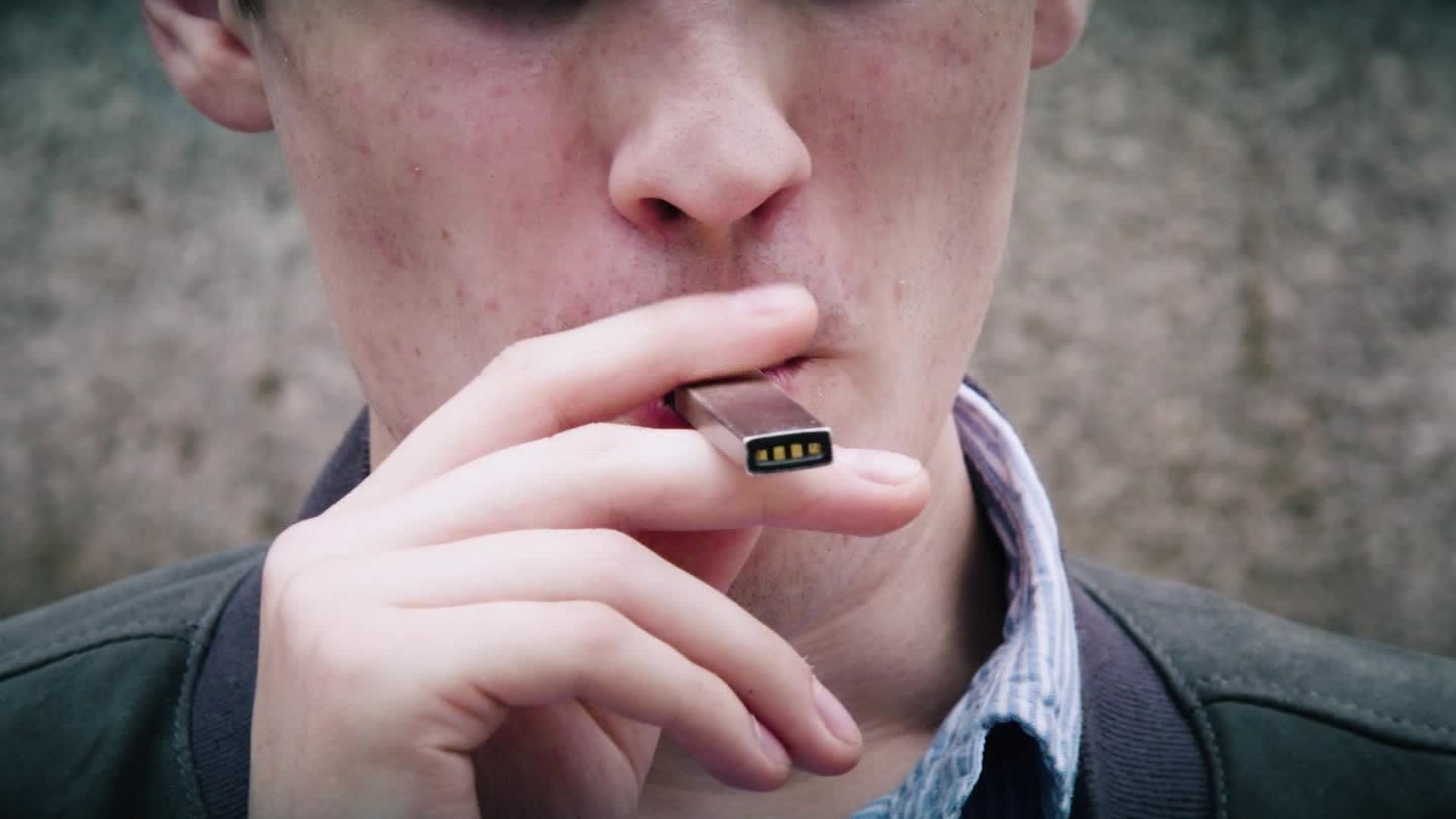 A man is seen vaping in this image provided by CNN.