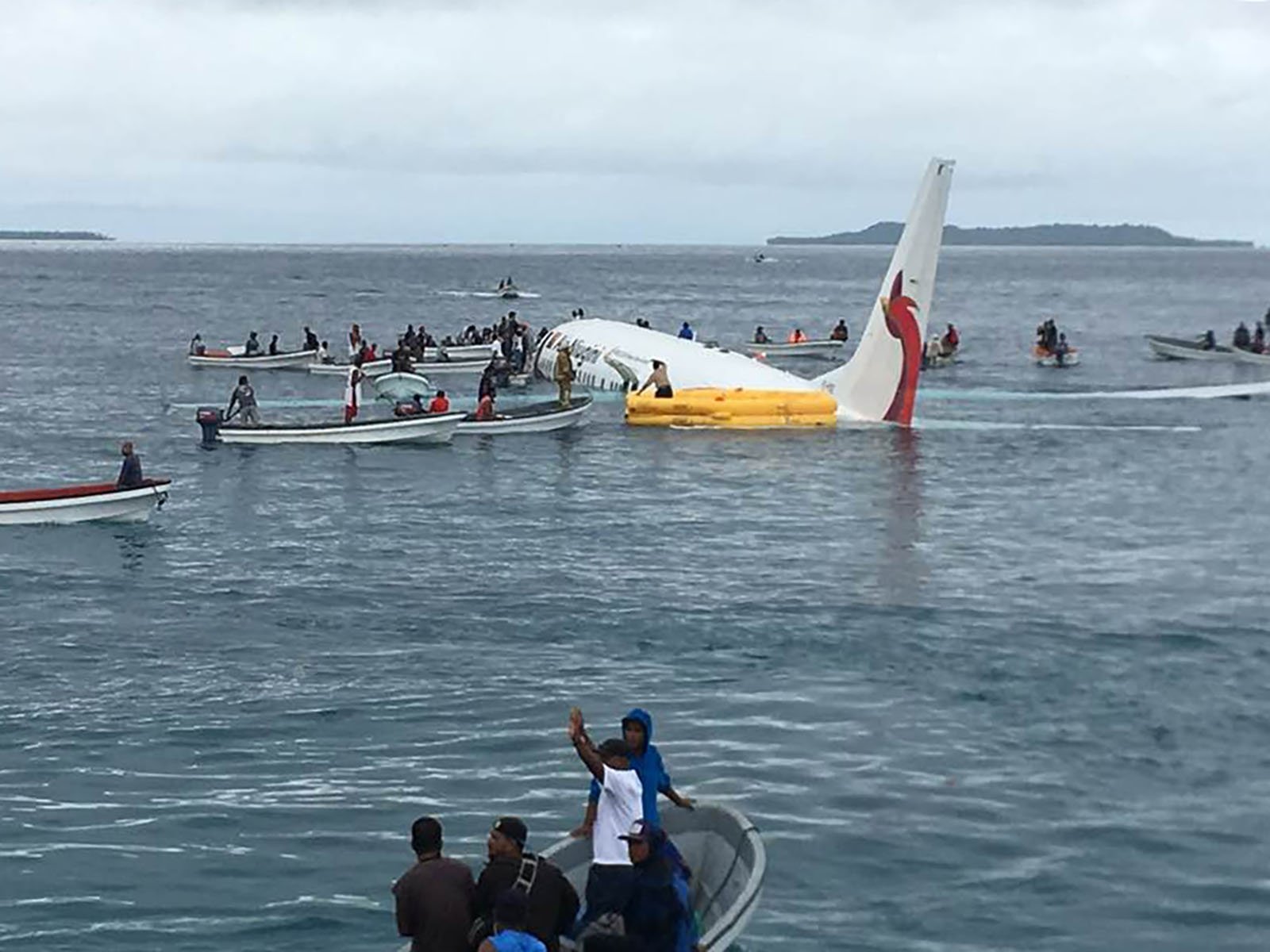 Dozens of airline passengers were forced to swim for their lives Friday after their plane missed a runway and landed in a sea lagoon on a remote island in the middle of the Pacific Ocean. (Credit: Dr. James Yaingeluo via CNN Wire)