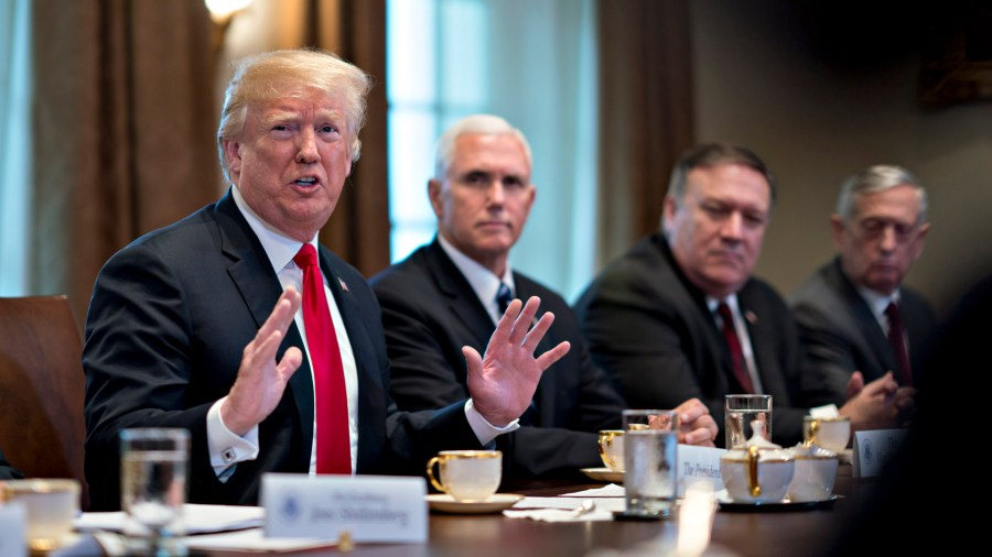 Defense Secretary James Mattis, far right, Secretary of State Mike Pompeo, second right, and Vice President Mike Pence, seated next to President Trump, have all denied writing an anonymous op-ed in the New York Times. They are seen in this file photo from May 17, 2018. (Credit: Andrew Harrer-Pool/Getty Images)