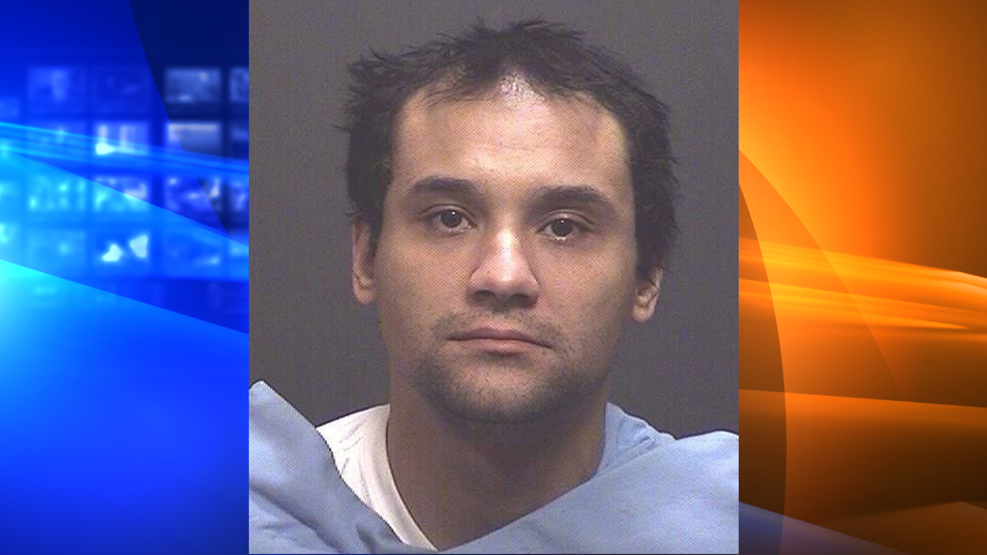 Christopher Matthew Clements is seen in a booking photo released by Tucson police.