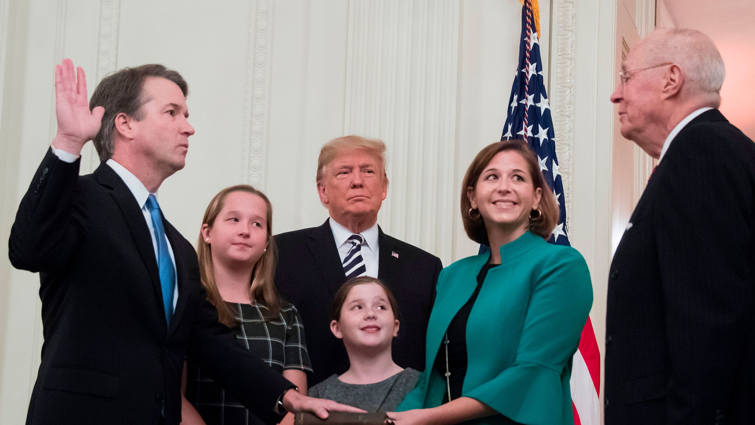 Brett Kavanaugh (L) is sworn-in as Associate Justice of the US Supreme Court by retired Associate Justice Anthony Kennedy on October 8, 2018, at the White House in Washington, DC. (Credit: JIM WATSON/AFP/Getty Images)