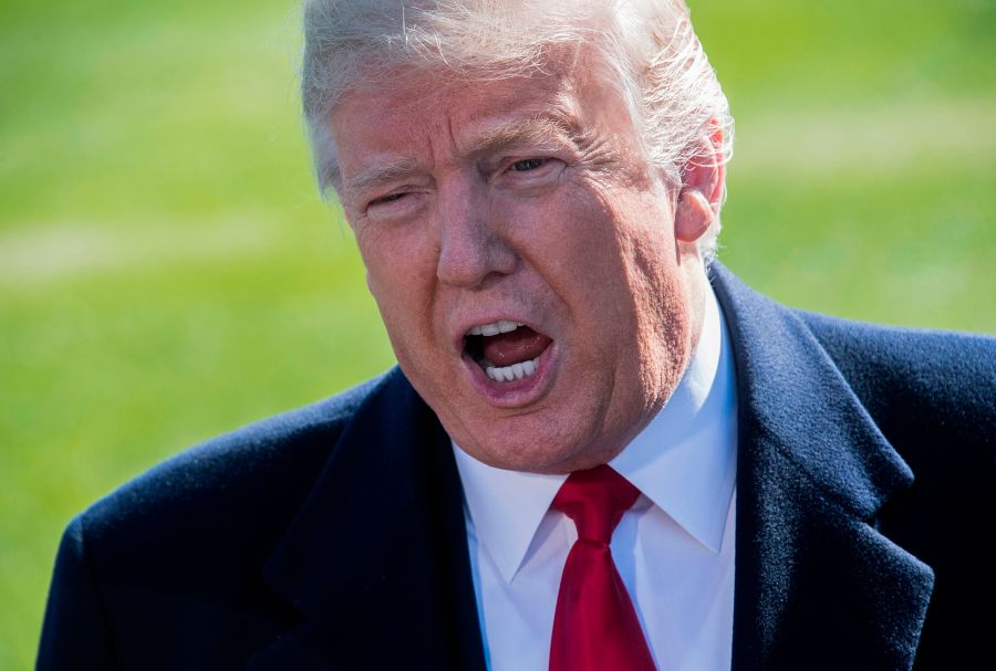 President Donald Trump speaks to the press as he departs the White House on Oct. 22, 2018. (Credit: Jim Watson / AFP / Getty Images)