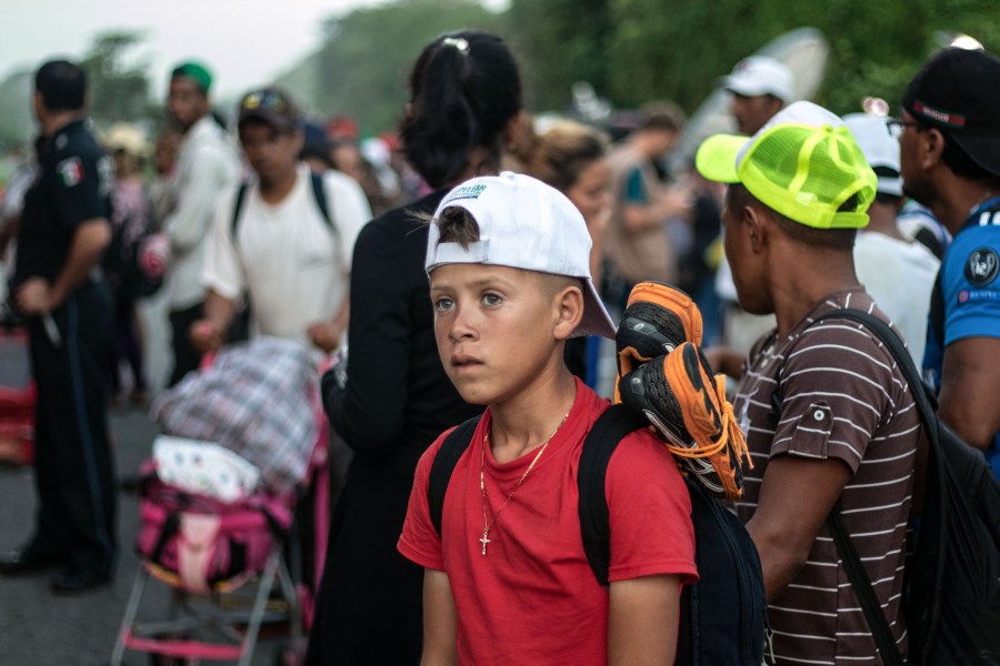 Honduran migrants heading in a caravan to the U.S., await at the roadside to get a ride, near Pijijiapan, southern Mexico on Oct. 26, 2018. (Credit: GUILLERMO ARIAS/AFP/Getty Images)