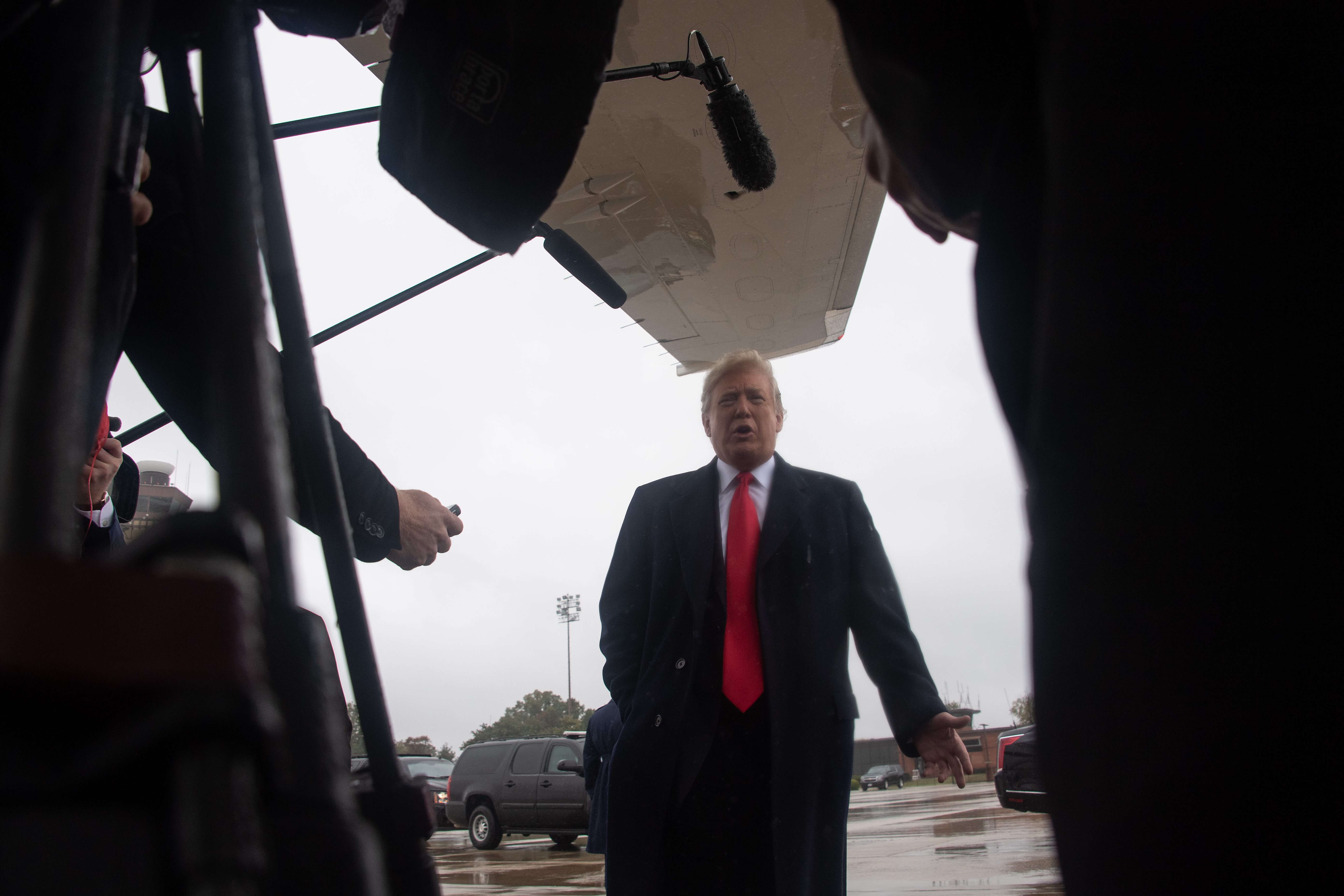 Donald Trump speaks to the press before boarding Air Force One at Andrews Air Force Base in Maryland on Oct. 27, 2018. (Credit: NICHOLAS KAMM/AFP/Getty Images)