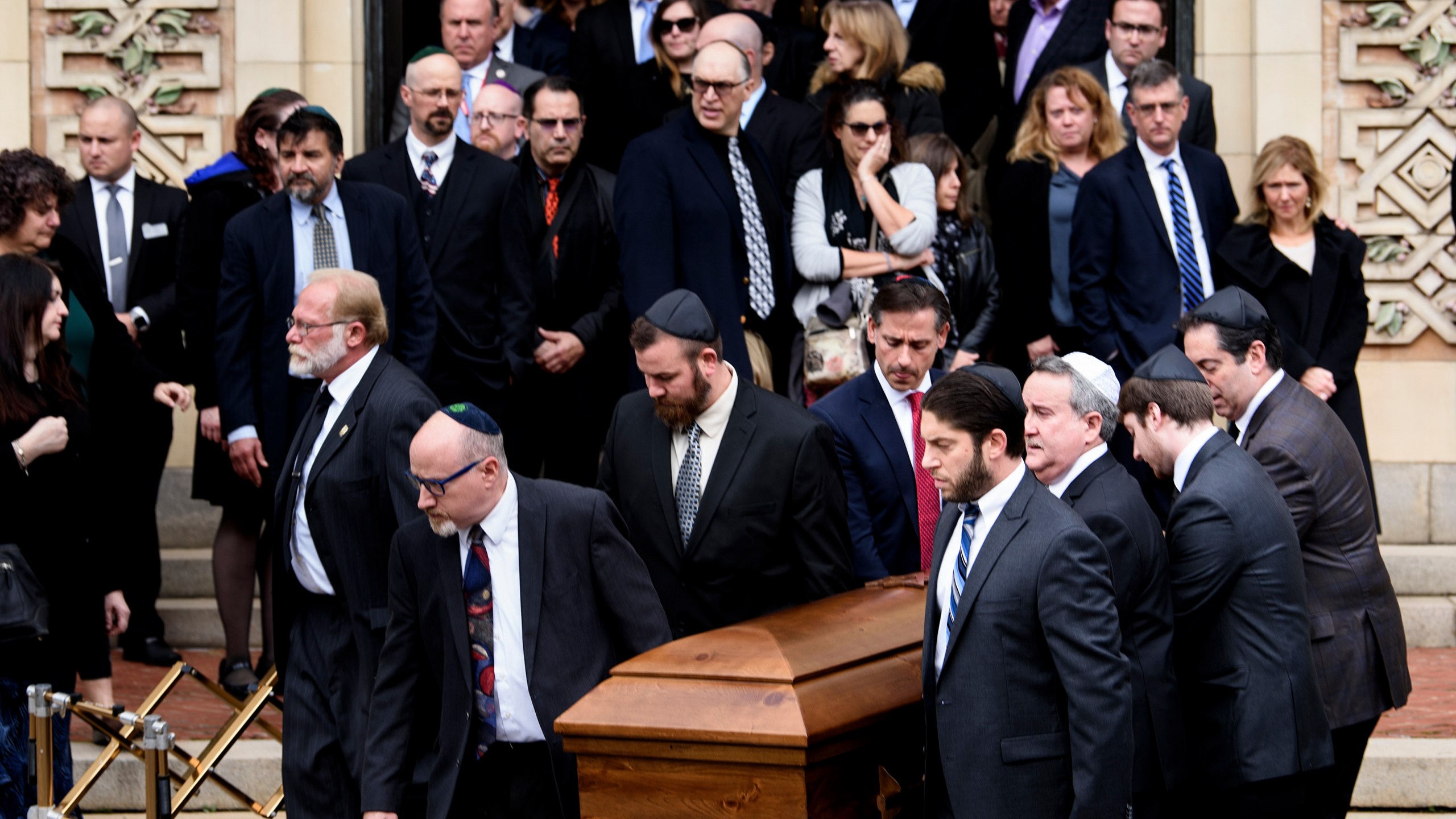 Pallbearers carry a casket from Rodef Shalom Congregation following the funeral for Tree of Life Congregation mass shooting victims, brothers Cecil Rosenthal and David Rosenthal, Oct. 30, 2018, in Pittsburgh, Pennsylvania. (Credit: Brendan Smialowski / AFP) (Photo credit should read BRENDAN SMIALOWSKI/AFP/Getty Images)