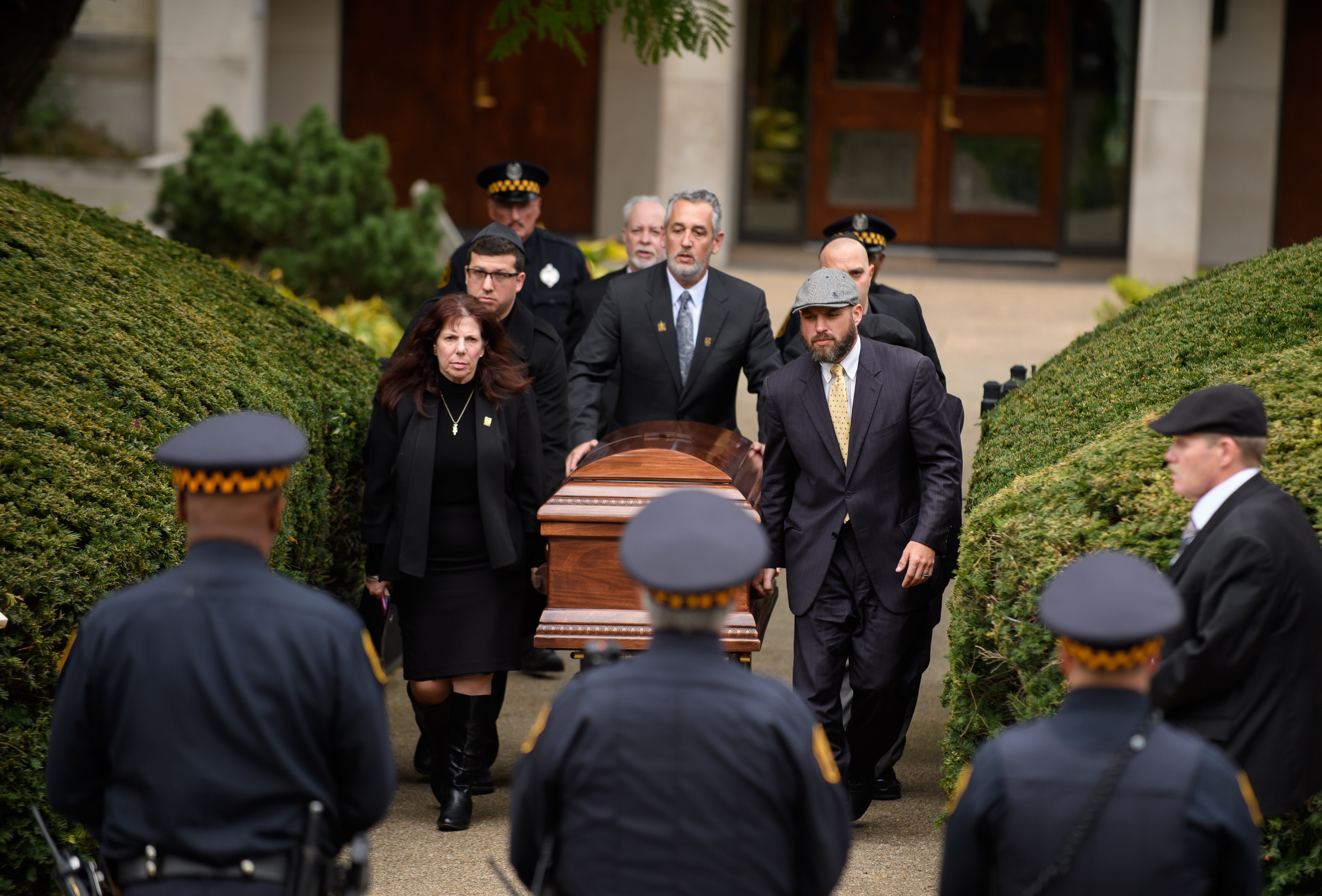 The casket of Irving Younger is led to a hearse outside Rodef Shalom Temple in Pittsburgh following his funeral on Oct. 31, 2018. (Credit: Jeff Swensen / Getty Images)