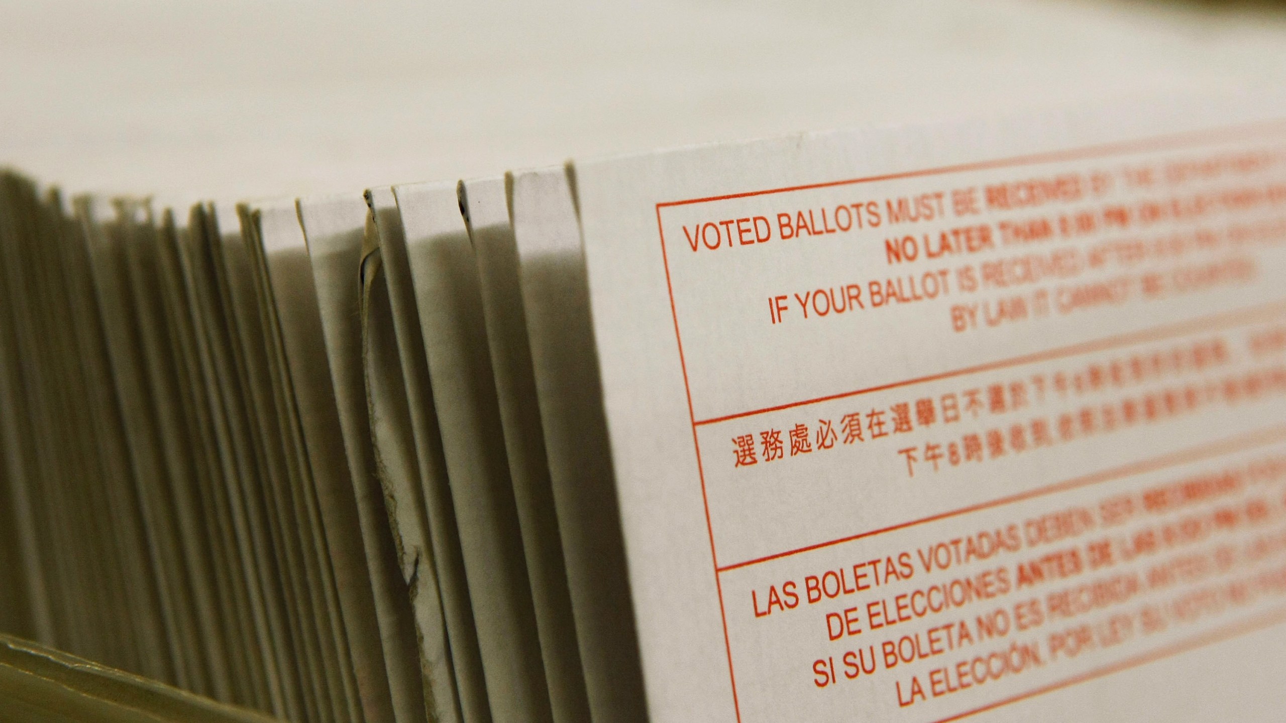 A stack of vote-by-mail ballots sit in a box after being sorted at the San Francisco Department of Elections January 24, 2008 in San Francisco. (Justin Sullivan/Getty Images)