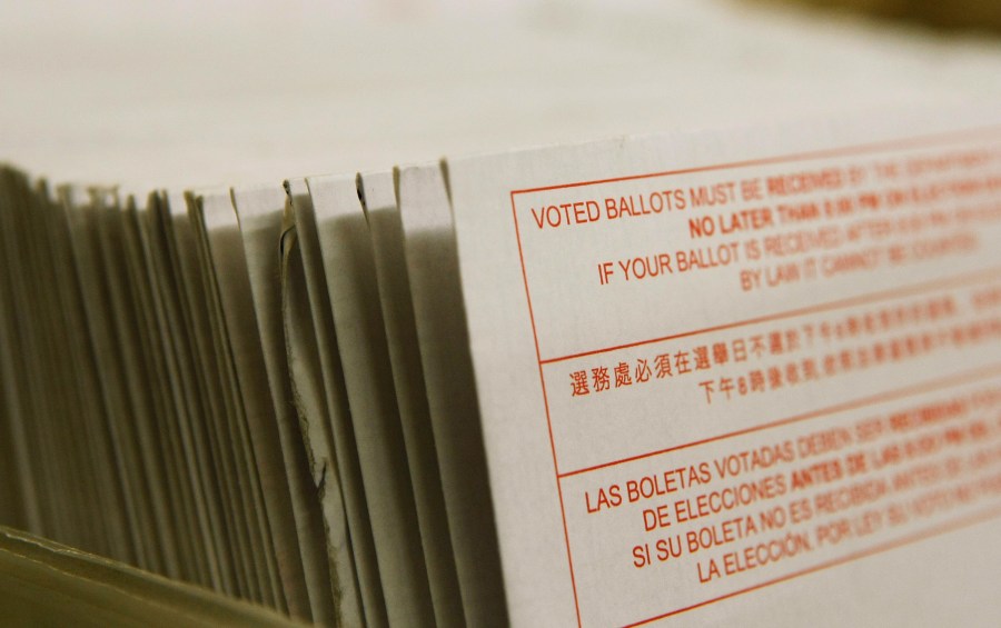 A stack of vote-by-mail ballots sit in a box after being sorted at the San Francisco Department of Elections January 24, 2008 in San Francisco. (Justin Sullivan/Getty Images)