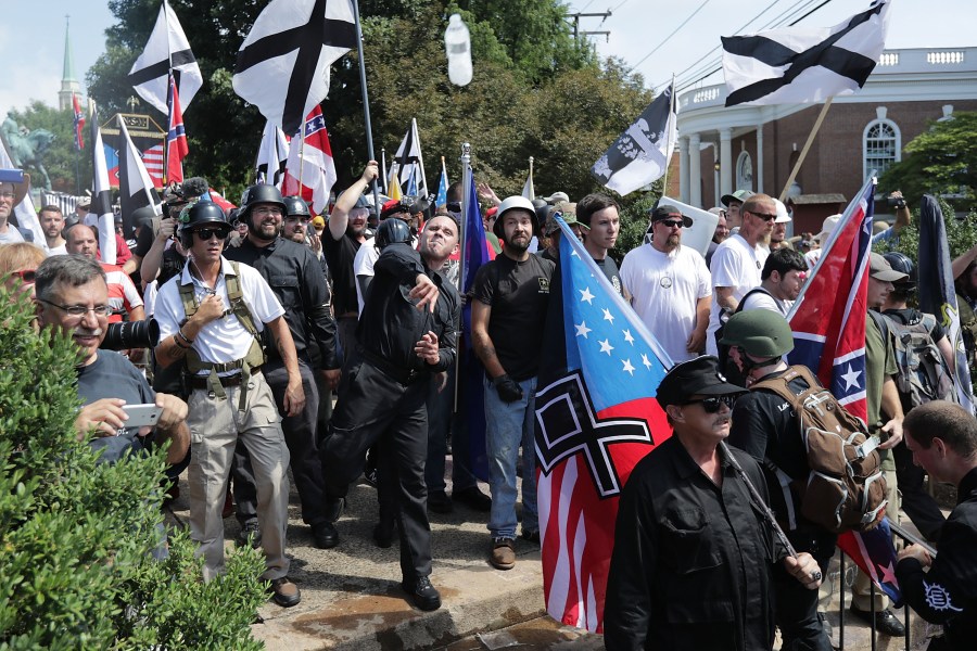 Hundreds of white nationalists, neo-Nazis, KKK and members of the "alt-right" hurl water bottles back and forth against counter demonstrators on the outskirts of Emancipation Park during the Unite the Right rally Aug. 12, 2017 in Charlottesville, Virginia. (Credit: Chip Somodevilla/Getty Images)