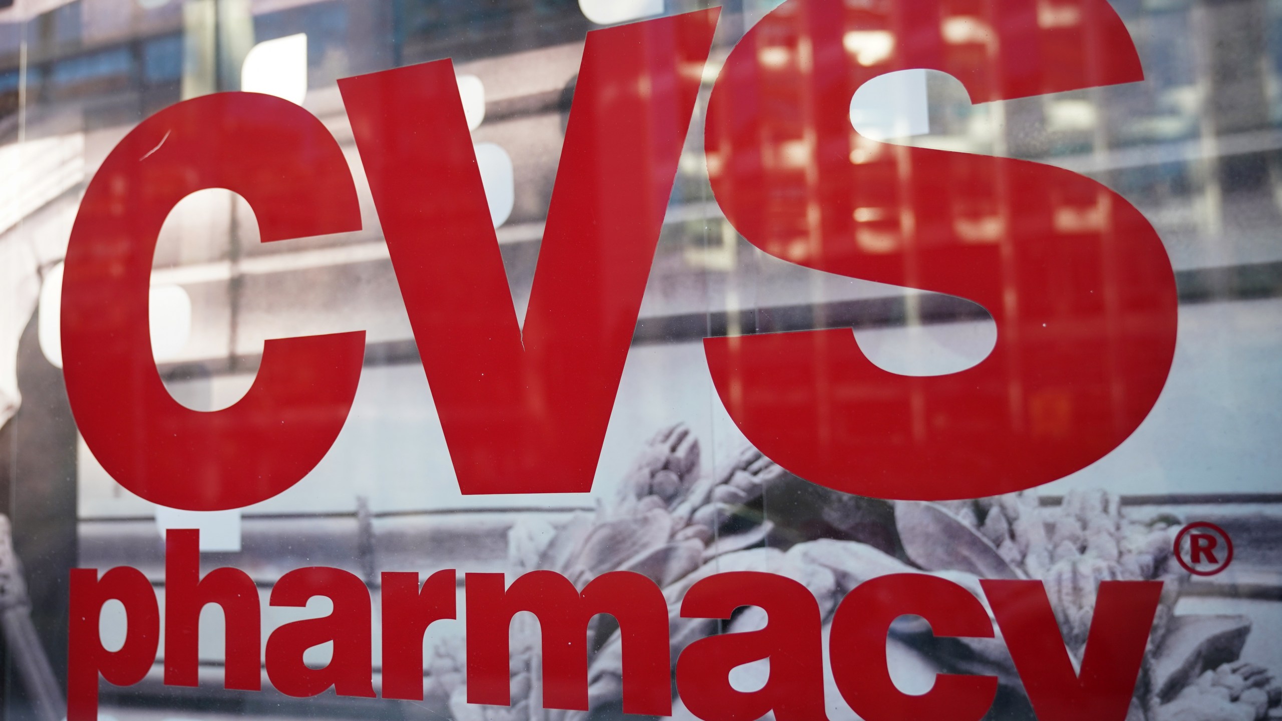 The CVS logo is seen in front of one of its stores in Washington, D.C on Dec. 3, 2017. (Credit: MANDEL NGAN/AFP/Getty Images)