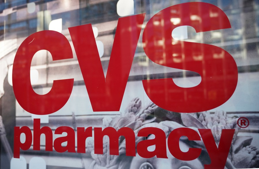 The CVS logo is seen in front of one of its stores in Washington, D.C on Dec. 3, 2017. (Credit: MANDEL NGAN/AFP/Getty Images)