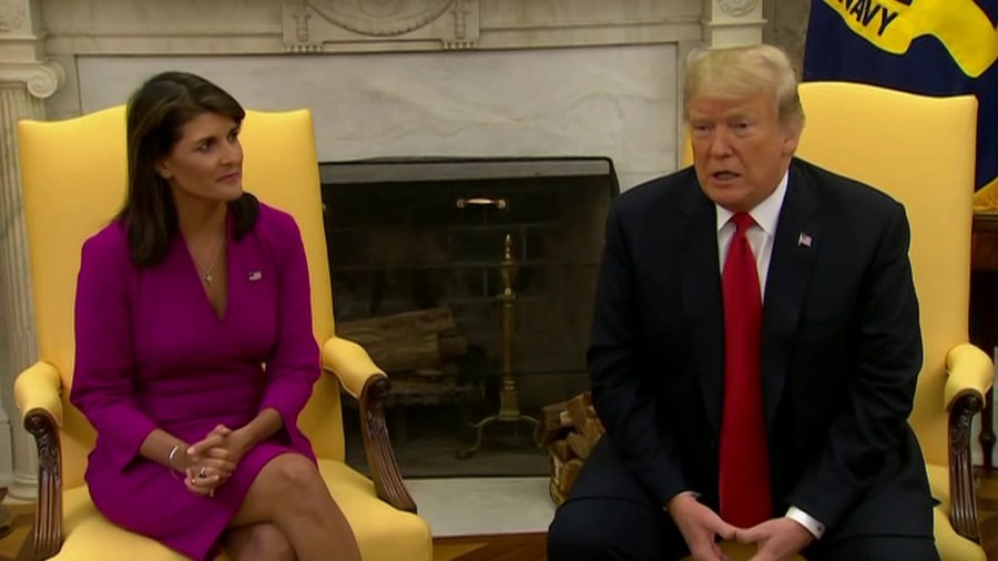 Nikki Haley announces her resignation as U.N. ambassador while sitting next to Donald Trump on Oct. 9, 2018. (Credit: CNN)