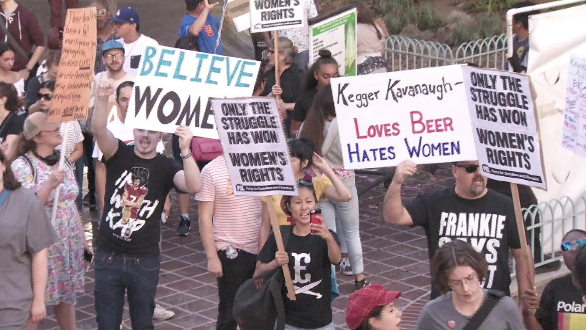 Protesters rally against the confirmation of Brett Kavanaugh, who's accused of sexual assault, to the Supreme Court during a rally in downtown L.A. on Oct. 7, 2018. (Credit: KTLA)