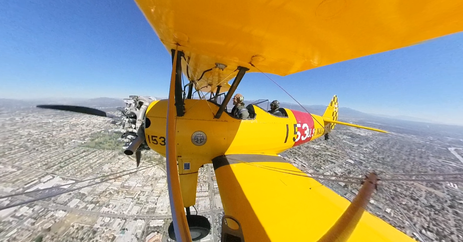 San Gabriel Valley Airport Association President Gabe Lopez pilots his 1939 Stearman biplane over the San Gabriel Valley, with KTLA Digital Producer Giovanni Moujaes riding along, on Oct. 16, 2018.