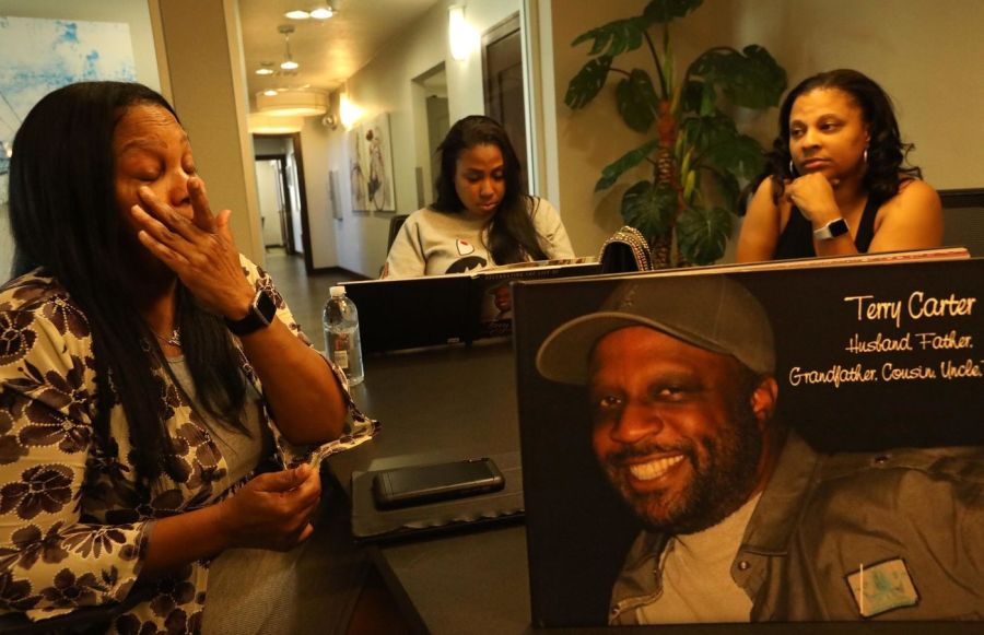 Terry Carter's wife, Lillian, left, with daughters Crystal and Nekaya, right, remember the patriarch of their family in Marina del Rey. (Credit: Genaro Molina / Los Angeles Times)