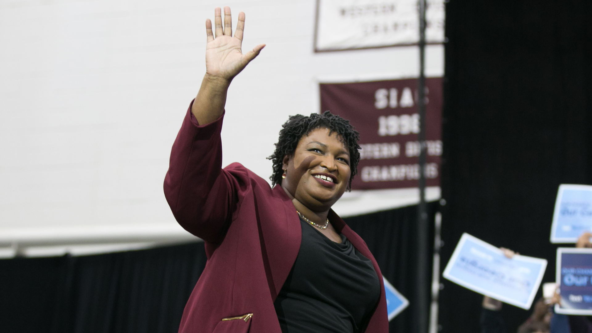 Georgia Democratic Gubernatorial candidate Stacey Abrams walks on stage and waves at the audience during a campaign rally at Morehouse College with former President Barack Obama on Nov. 2, 2018, in Atlanta. (Jessica McGowan/Getty Images)