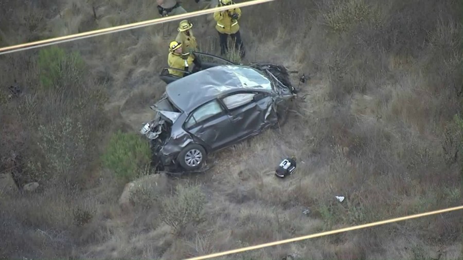 L.A. County Fire personnel responded to Castaic Canyons after a body was discovered in a car that went off the roadway on Nov. 7, 2018. (Credit: KTLA)