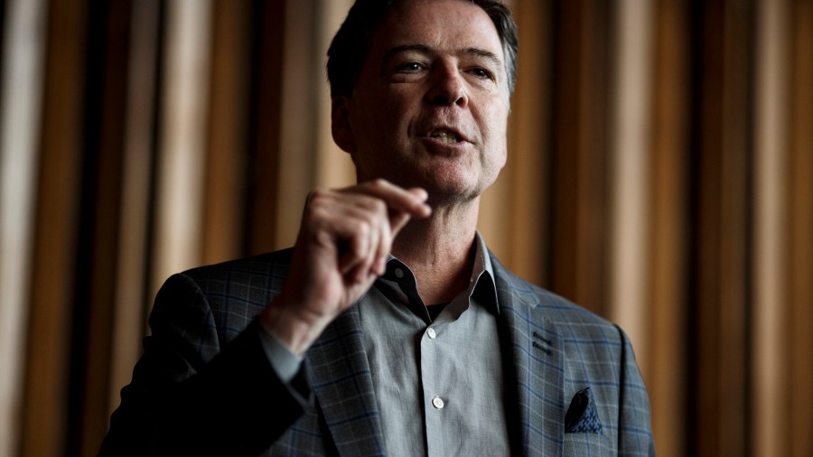 Former FBI Director James Comey talks backstage before a panel discussion about his book "A Higher Loyalty" on June 19, 2018 in Berlin, Germany. (Credit: Carsten Koall/Getty Images)